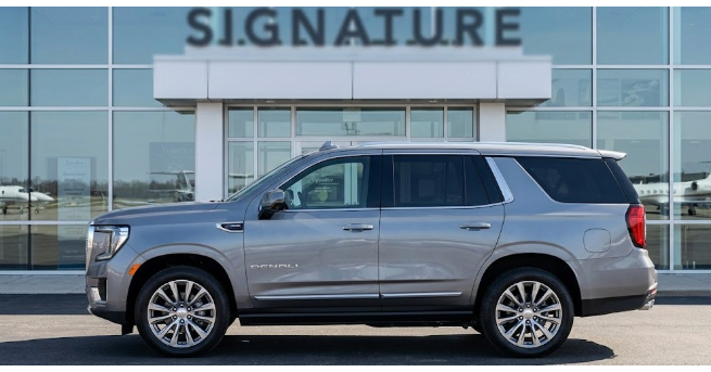 Silver GMC Yukon parked outside Signature Aviation for private airport chauffeur pickup